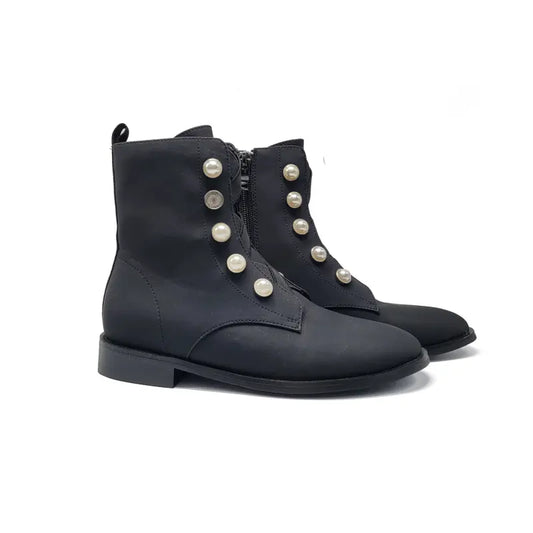 Black boots with pearl embellishments on a white background