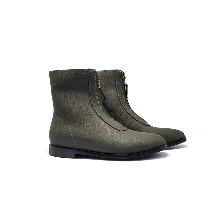 Pair of green boots on a white background