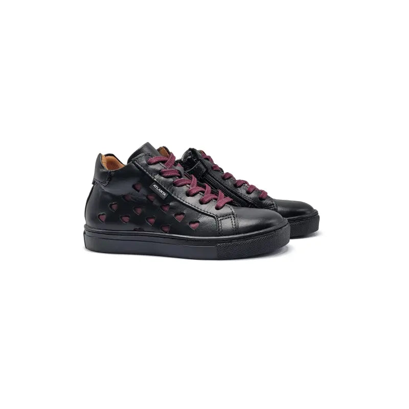 Black sneakers with red heart patterns on a white background