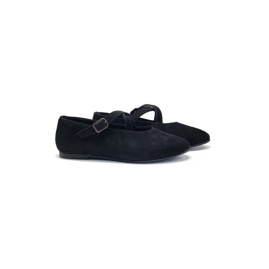 Black suede shoes with a buckle on a white background