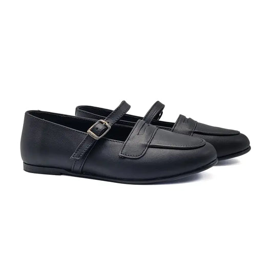 Pair of black loafers with a strap on a white background