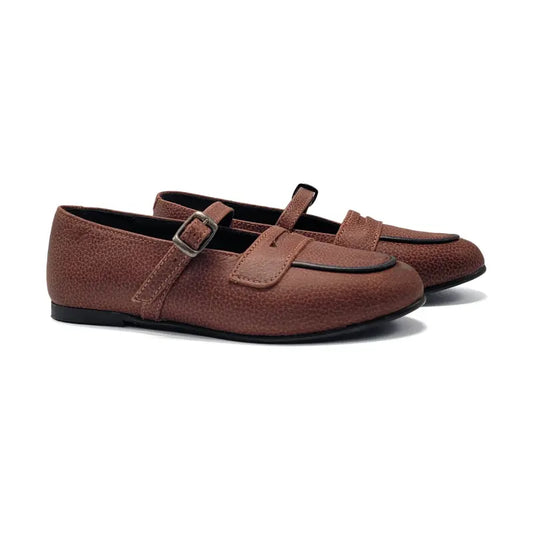Pair of brown loafers with a strap on a white background
