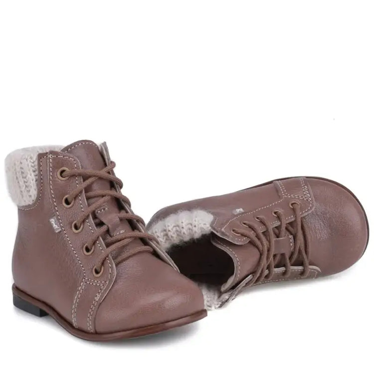 Pair of brown children's boots with white fur lining on a white background