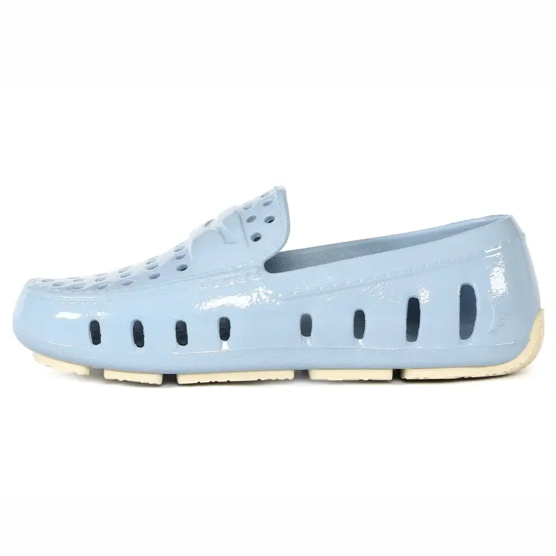 Light blue shoe with a white sole on a white background