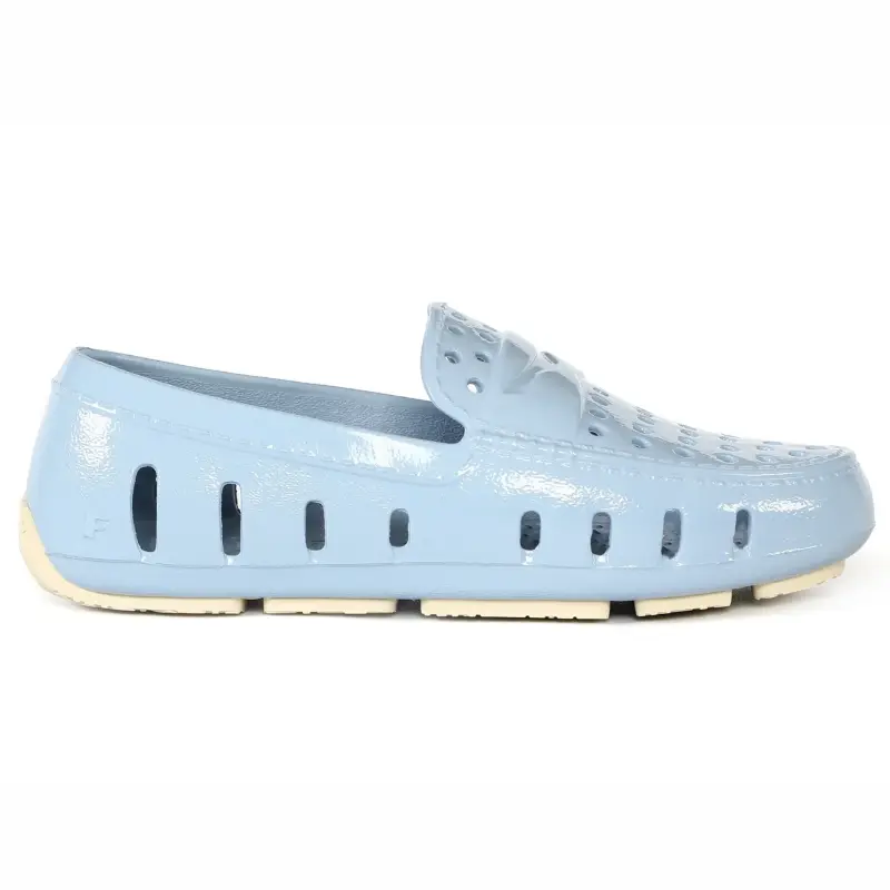 Light blue shoe with a white sole on a white background