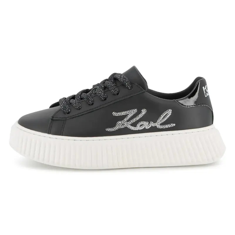 Black sneaker with 'Karl' text on a white background