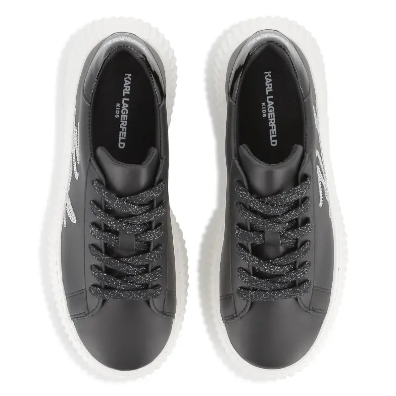 Black sneakers with glittery laces on a white background, branded 'Karl Lagerfeld Kids'.