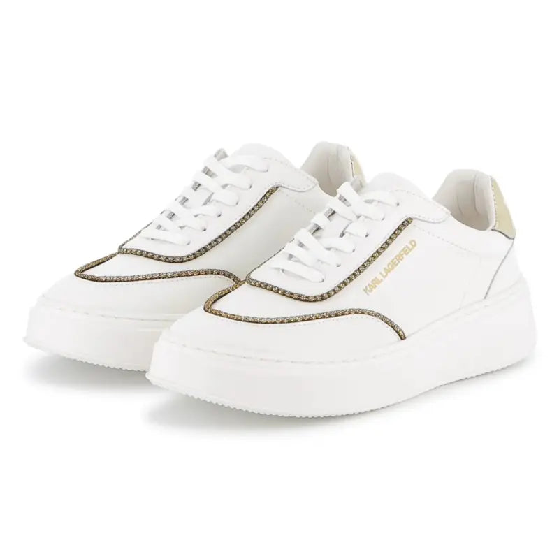 White sneakers with gold accents on a white background