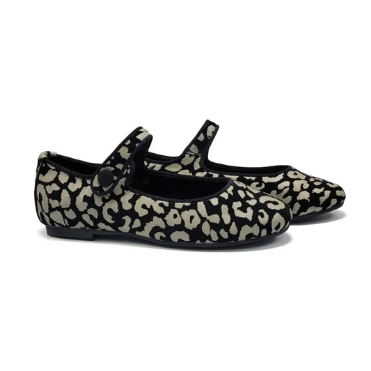 Pair of leopard print shoes with black straps on a white background