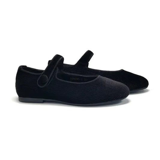 Pair of black shoes with a strap on a white background