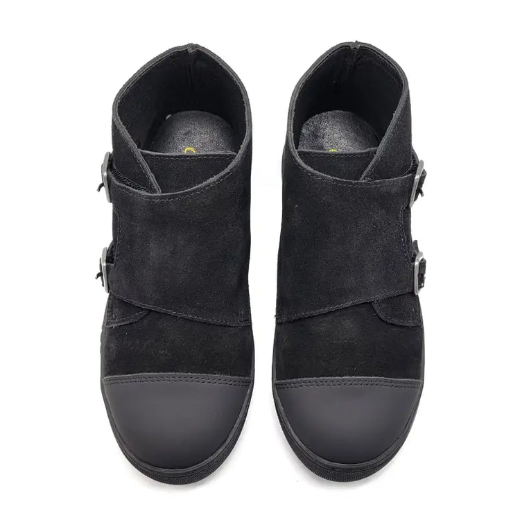 Pair of black suede ankle boots with buckles on a white background