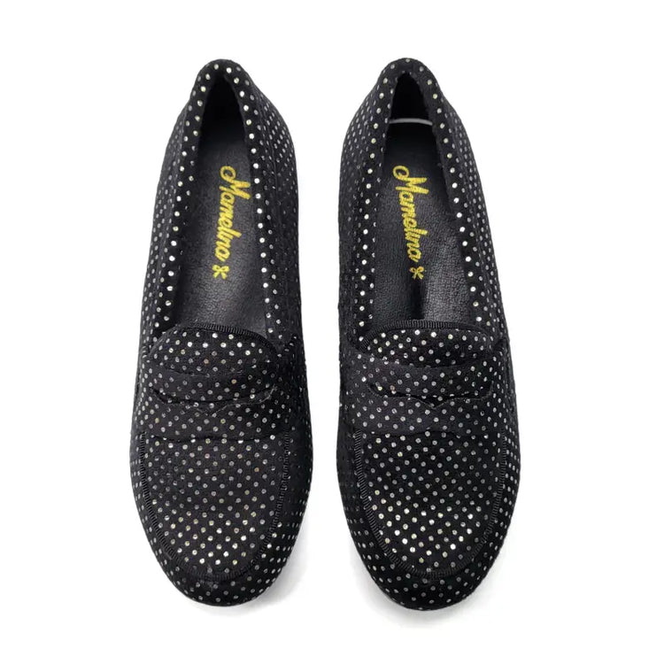 Black loafers with rhinestone embellishments on a white background
