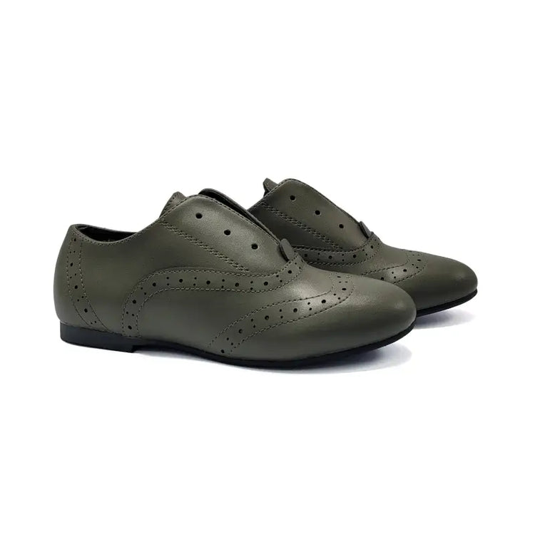 Pair of green shoes on a white background