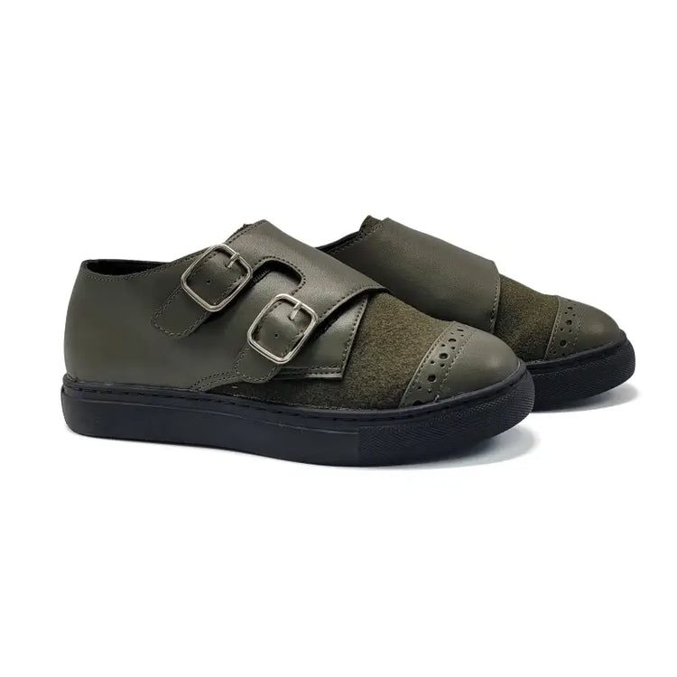 Pair of green shoes with buckles on a white background
