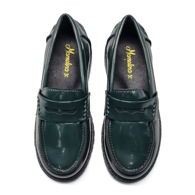 Pair of green loafers with a brand logo on a white background