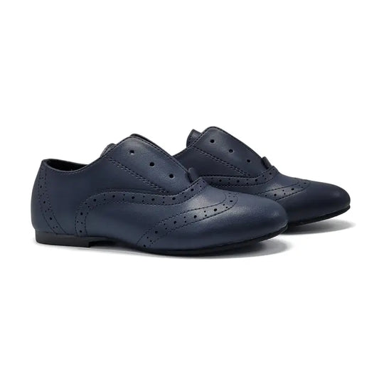 Pair of navy blue shoes on a white background