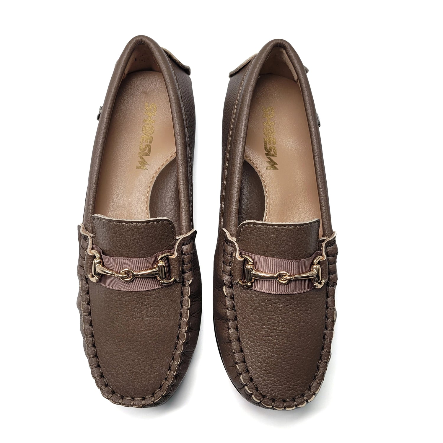 Pair of brown loafers with gold accents on a white background