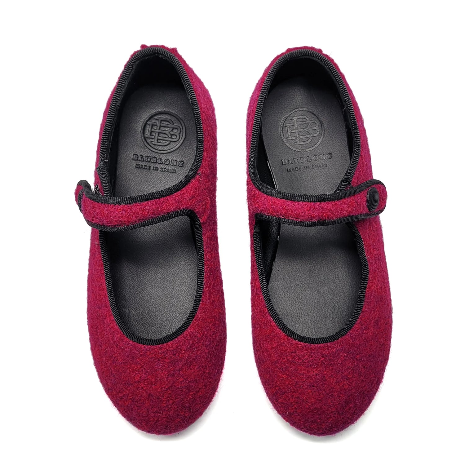 Pair of fuchsia mary jane with black soles on a white background