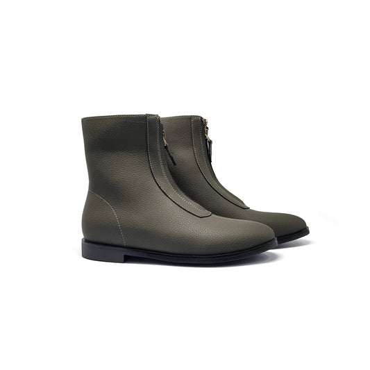 Pair of green  boots on a white background