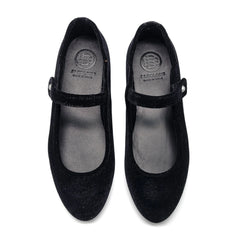 Pair of black shoes with a visible brand logo on a white background