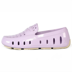Lavender patent leather shoe on a white background