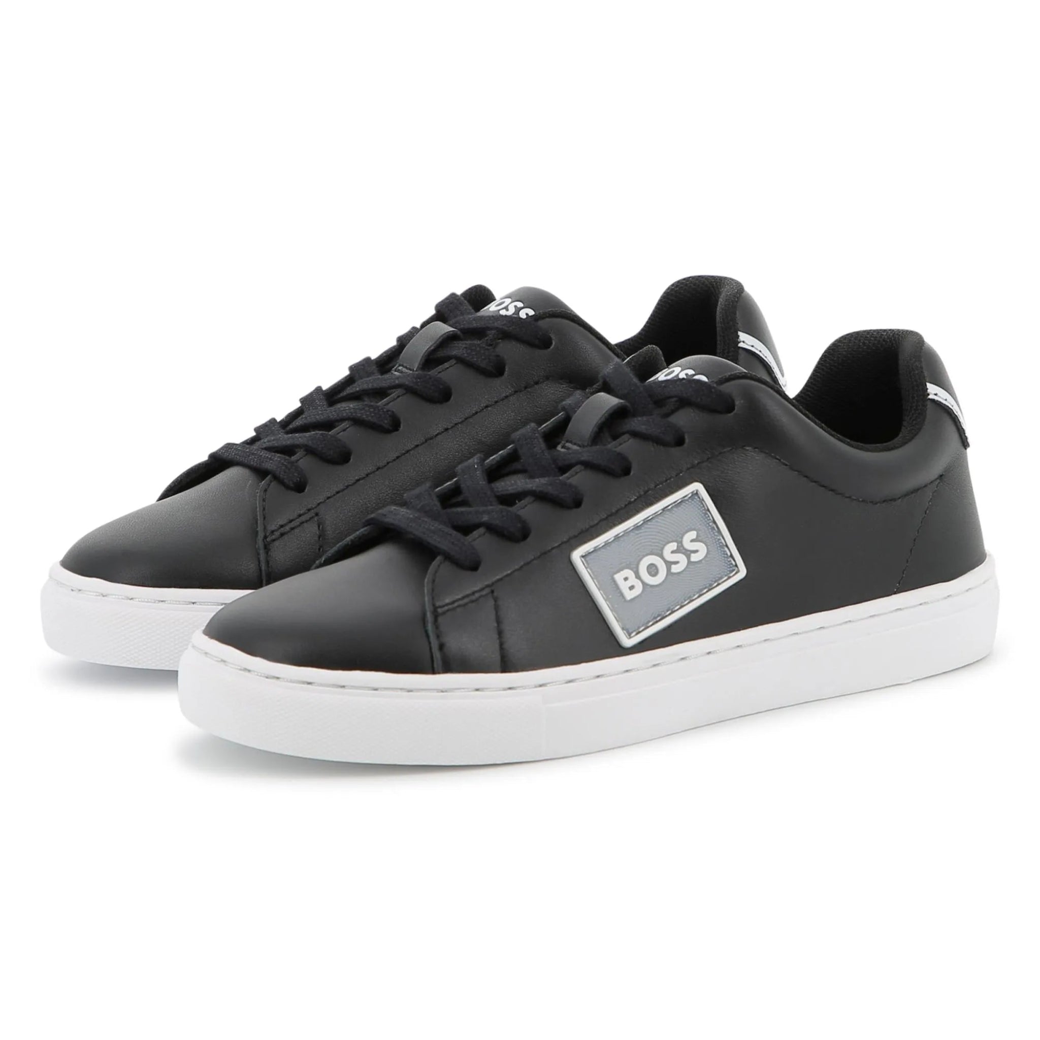 Black sneakers with a visible brand logo on a white background