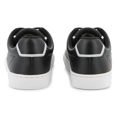 Black sneakers with white soles on a white background
