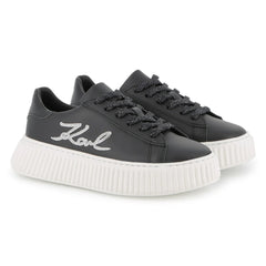 Black sneakers with white sole on a white background