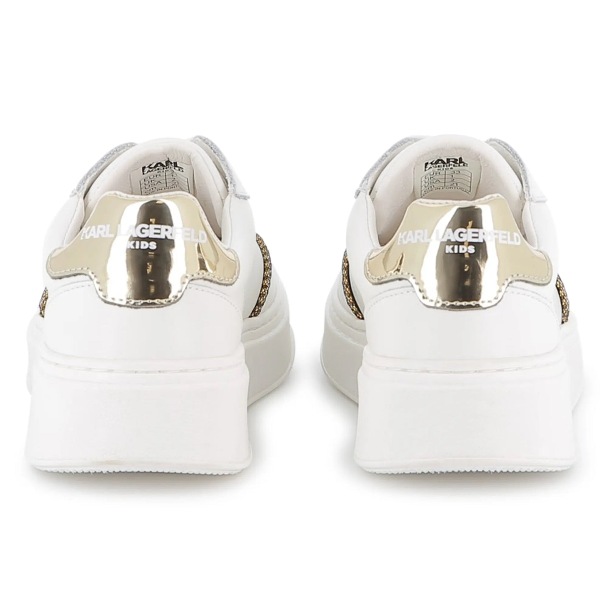 White sneakers with gold accents on a white background