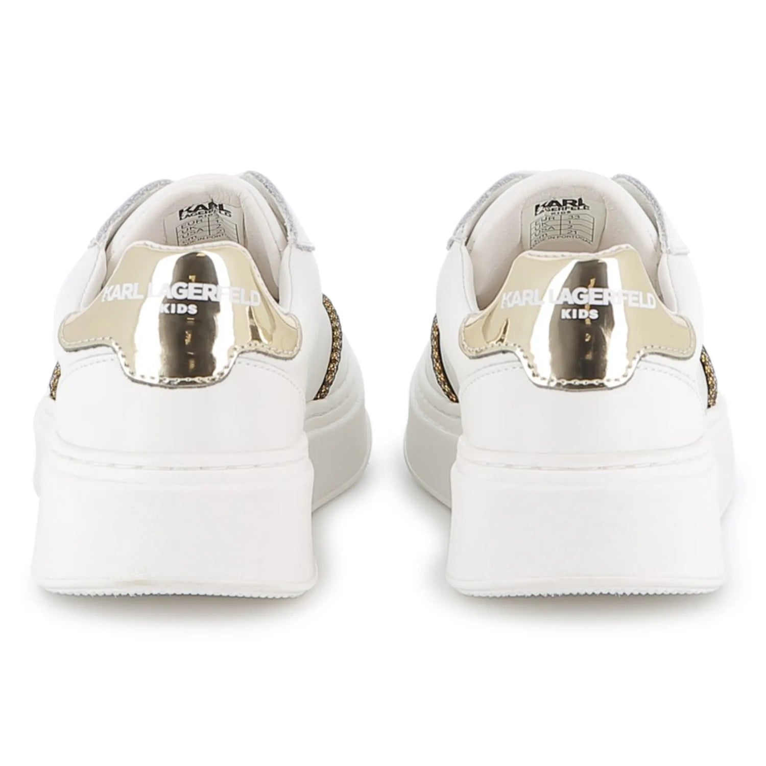 White sneakers with gold accents on a white background