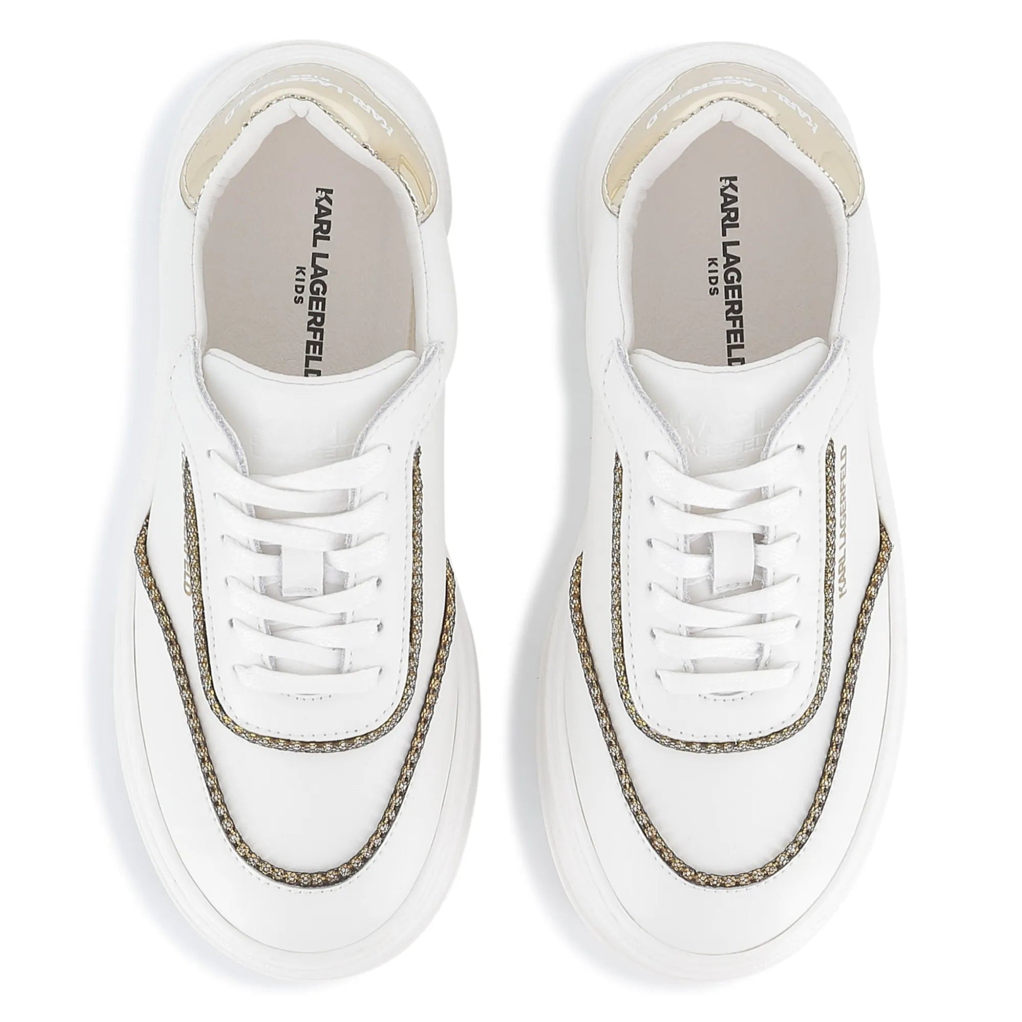 White sneakers with gold accents on a white background