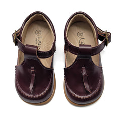 Pair of brown children's sandals with a strap on a white background