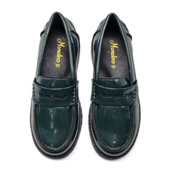 Pair of green loafers with a brand logo on a white background