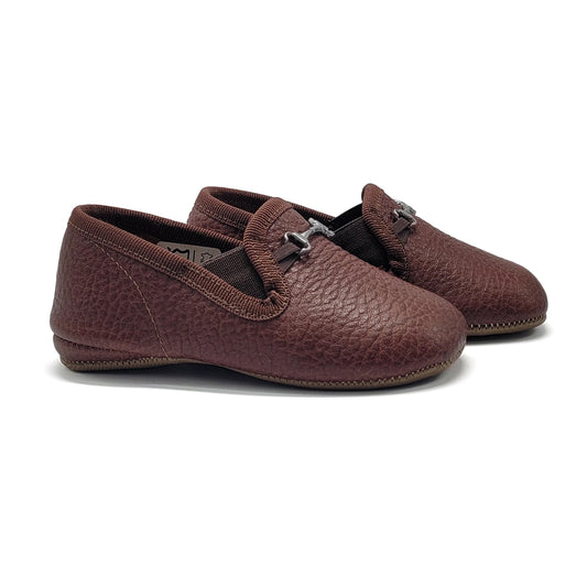 Pair of brown leather loafers on a white background