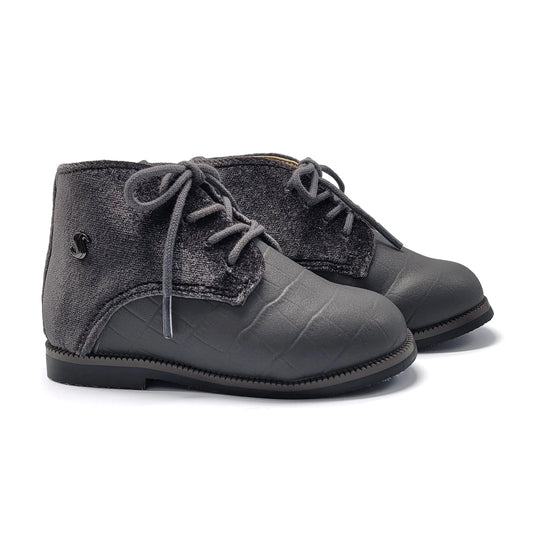 Pair of gray children's boots with lace-up design on a white background