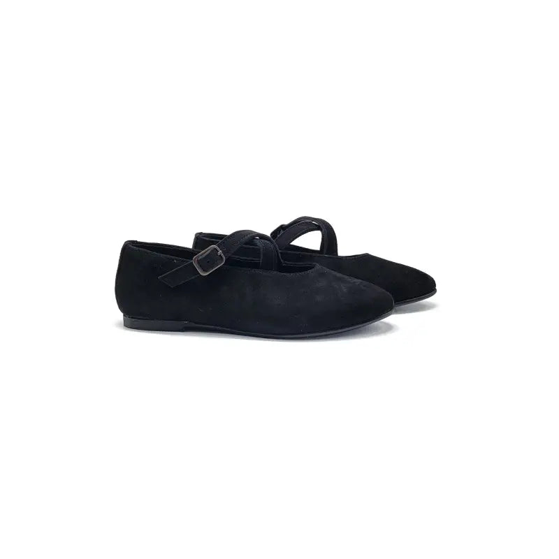 Black suede shoes with a buckle on a white background