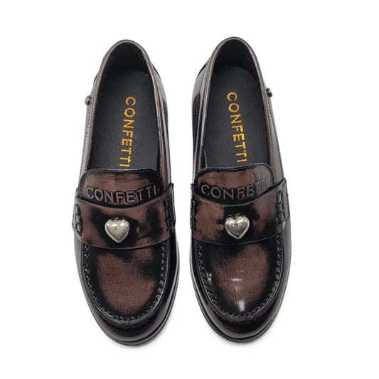 Pair of brown loafers with heart-shaped embellishments on a white background