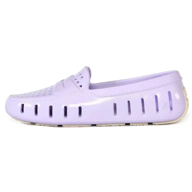 Lavender shoe with a white sole on a white background
