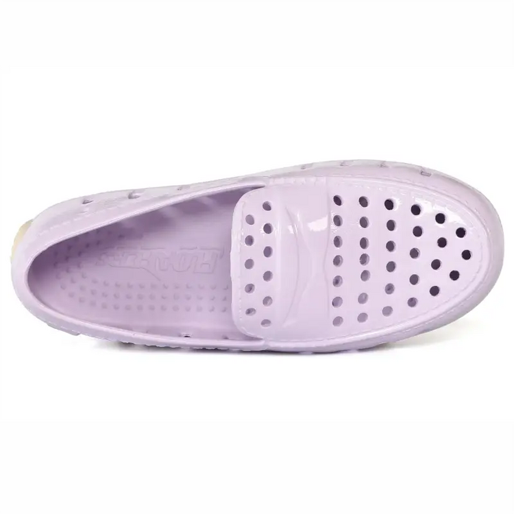 Purple sandal with a white sole on a white background