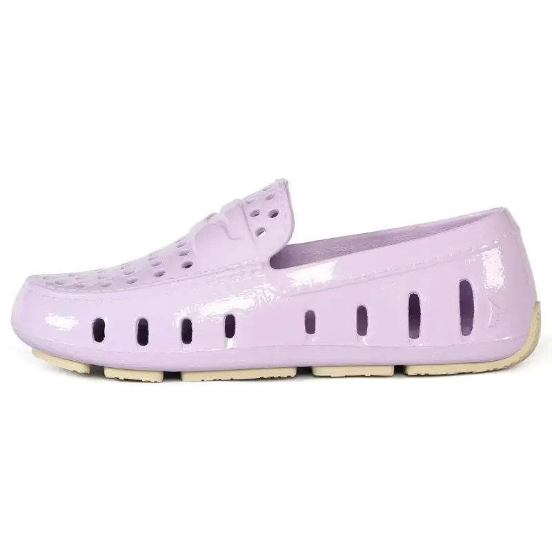 Lavender patent leather shoe on a white background