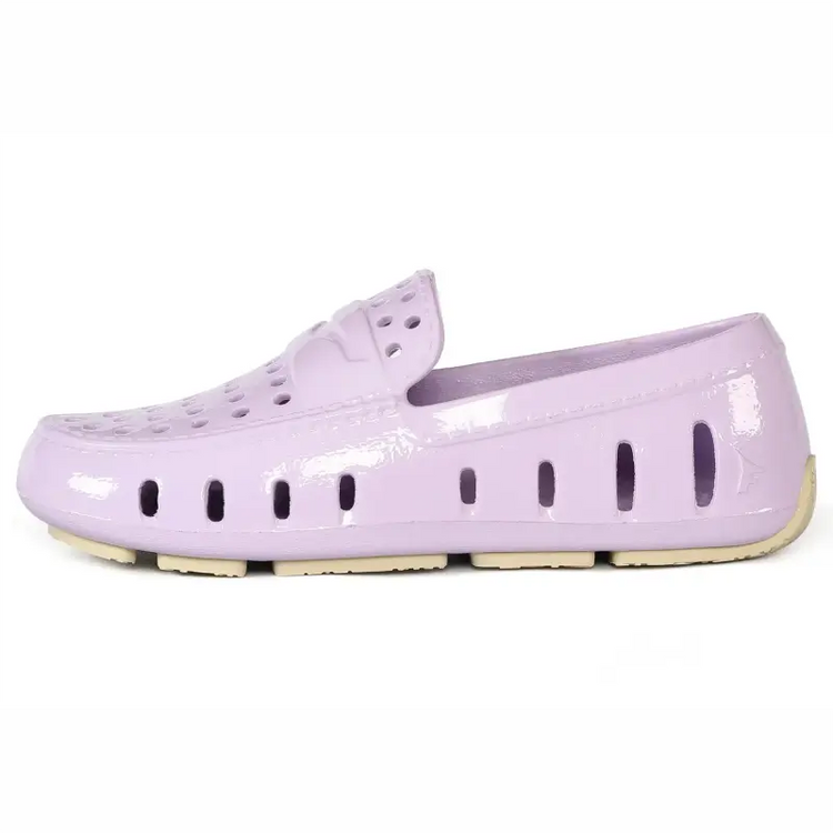 Lavender patent leather shoe on a white background