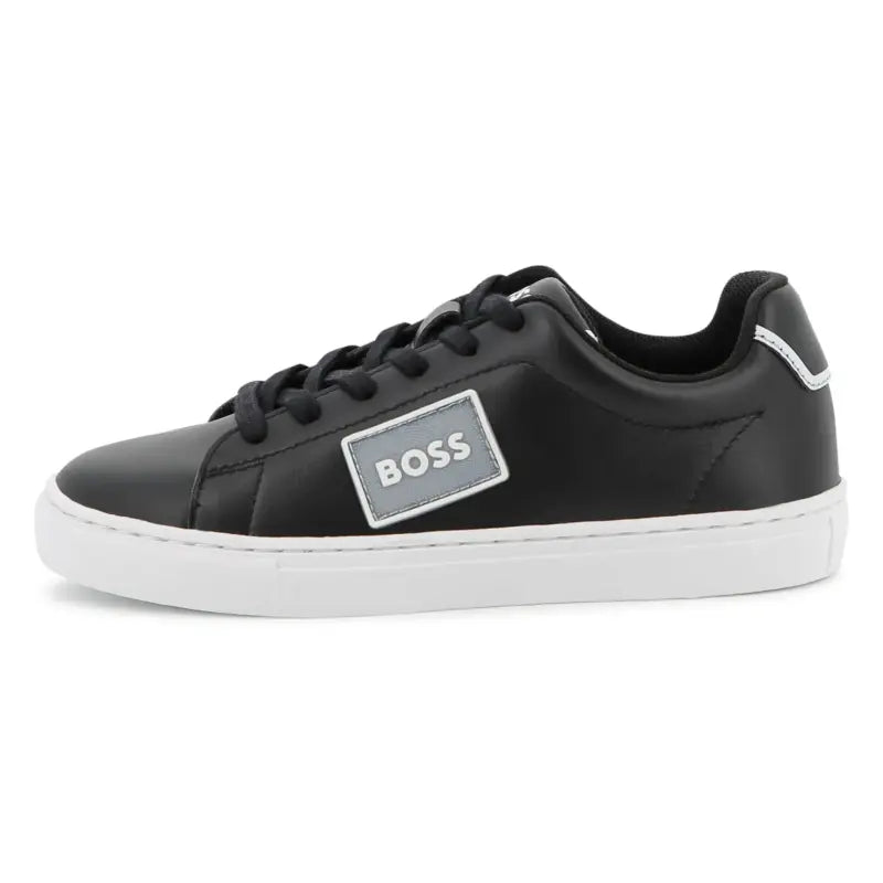 Black sneaker with a 'BOSS' logo on a white background