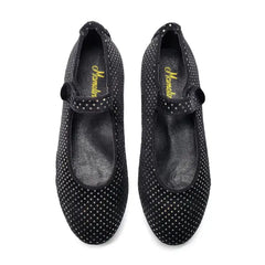 Pair of black polka dot shoes with a brand logo on a white background