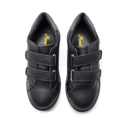 Pair of black shoes with velcro straps on a white background