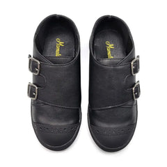 Pair of black shoes with buckles on a white background