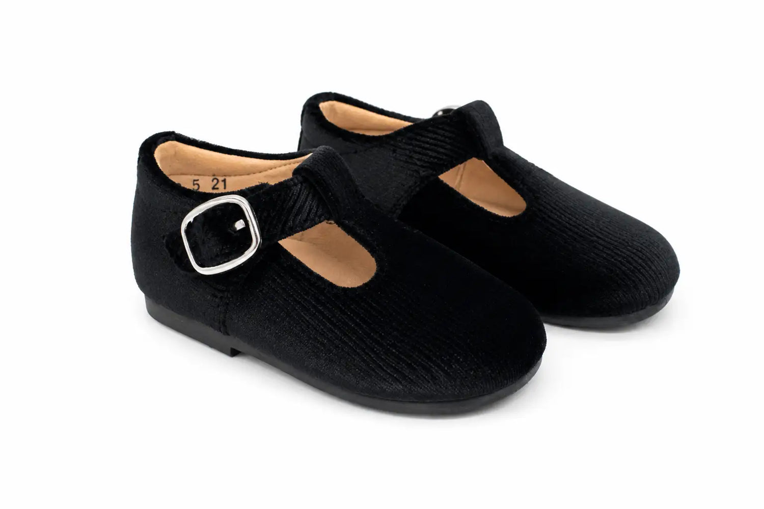 A pair of black Mary Jane style shoes with a textured fabric upper, a strap with a silver buckle, and a light tan interior, shown on a white background.