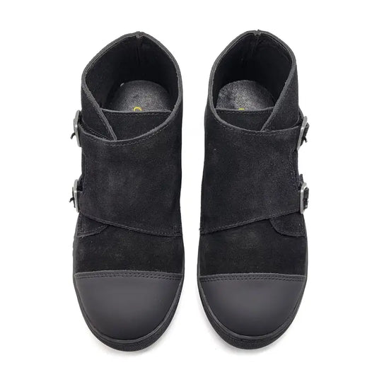 Pair of black suede ankle boots with buckles on a white background