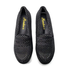 Black loafers with rhinestone embellishments on a white background