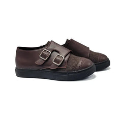 Pair of brown shoes with double buckles on a white background