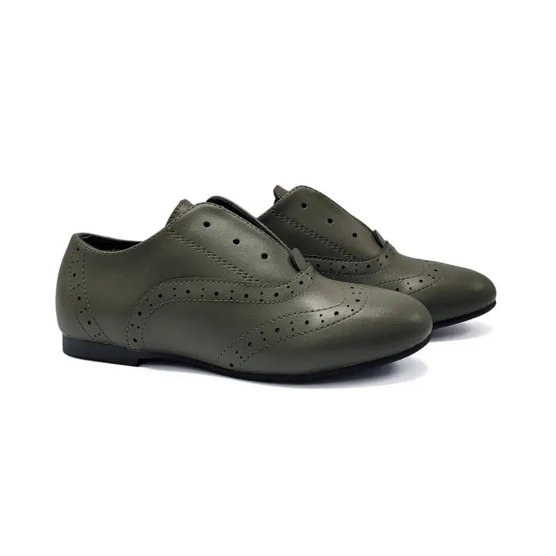 Pair of green shoes on a white background